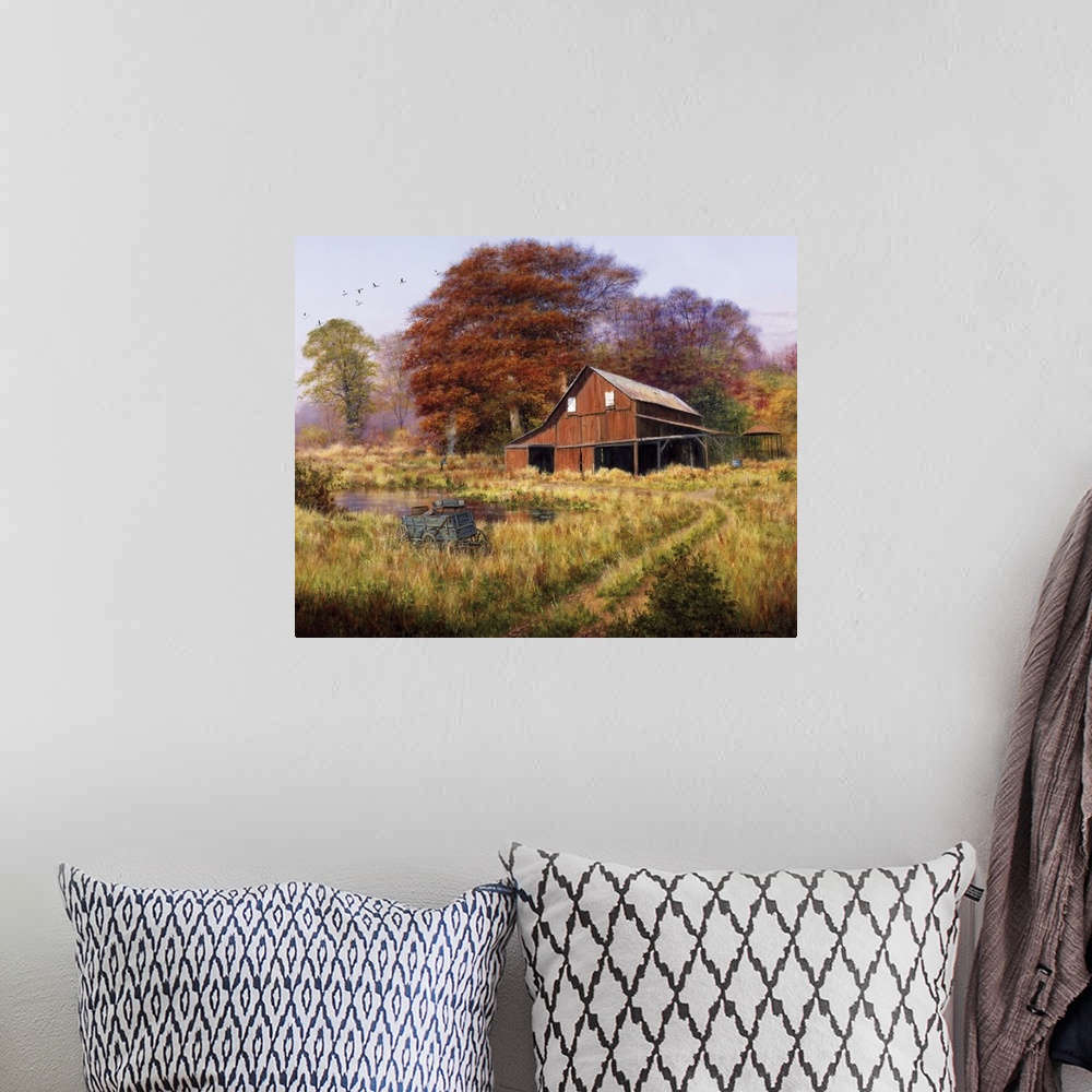 A bohemian room featuring Red barn by pond in field with geese flying south in formation aboveautumn, fall, foliage.