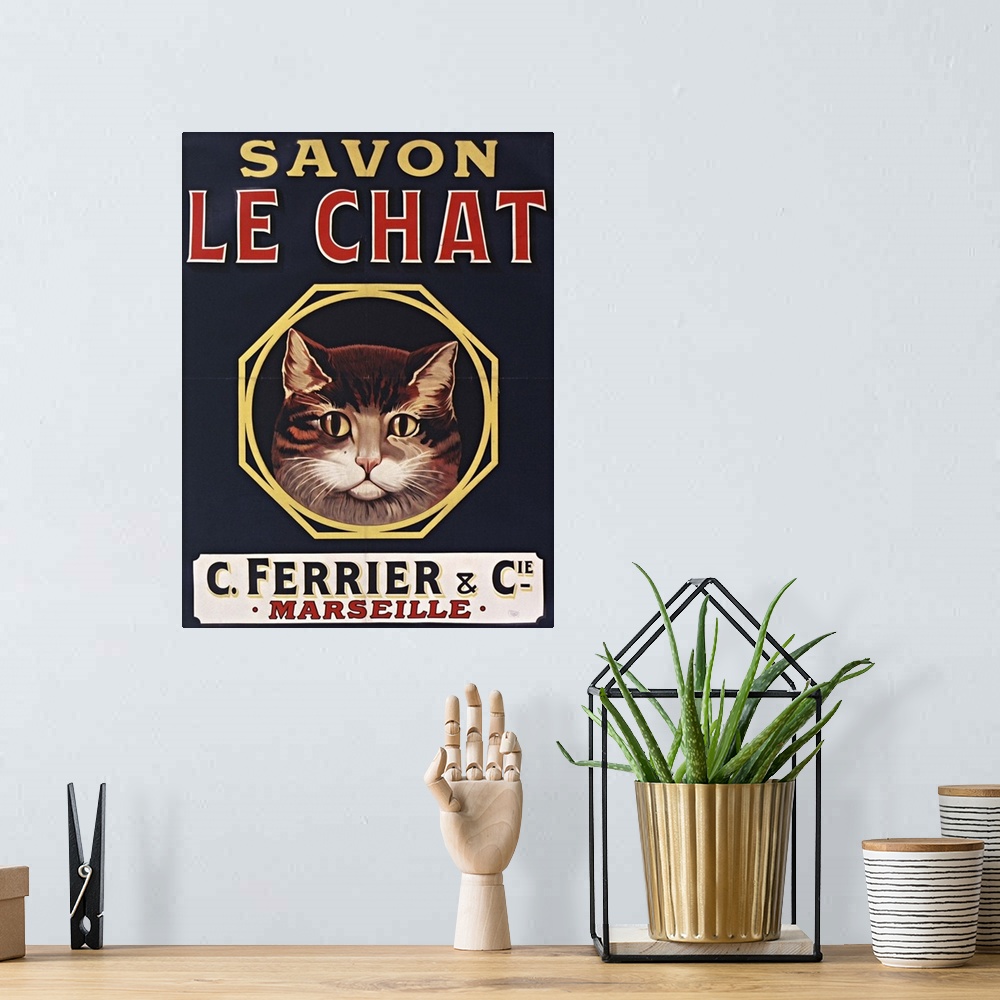 A bohemian room featuring Vintage poster advertisement for Savon Le Chat Black.