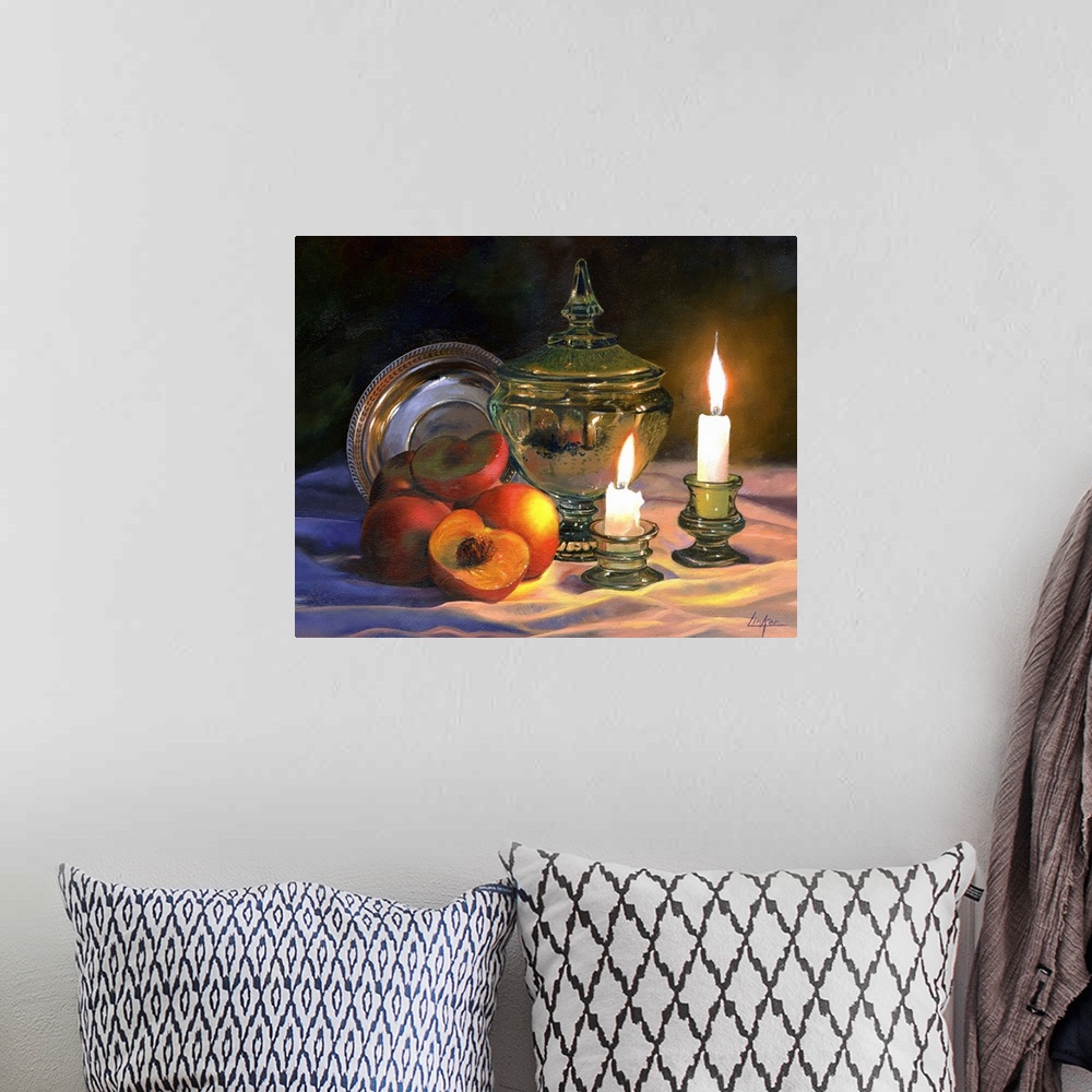 A bohemian room featuring Contemporary still life of peaches and lit candles.