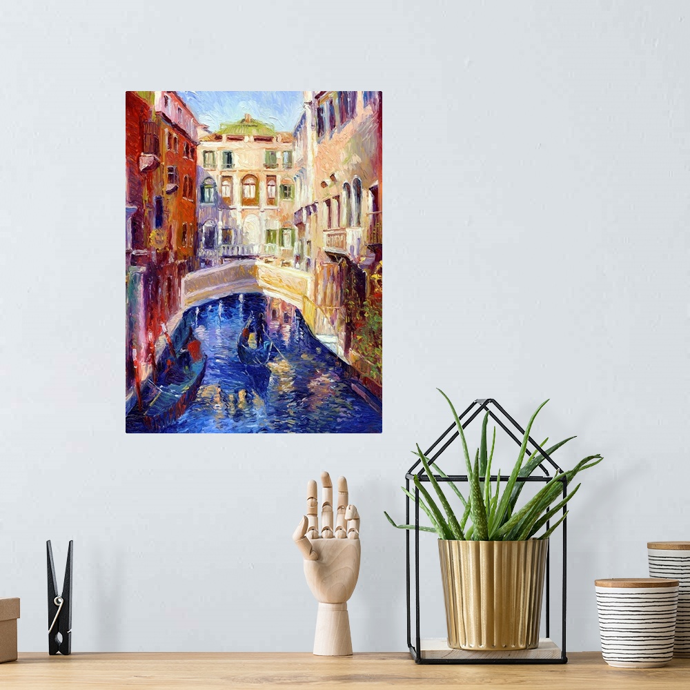 A bohemian room featuring A canal in Venice with gondolas on it and houses on either side.