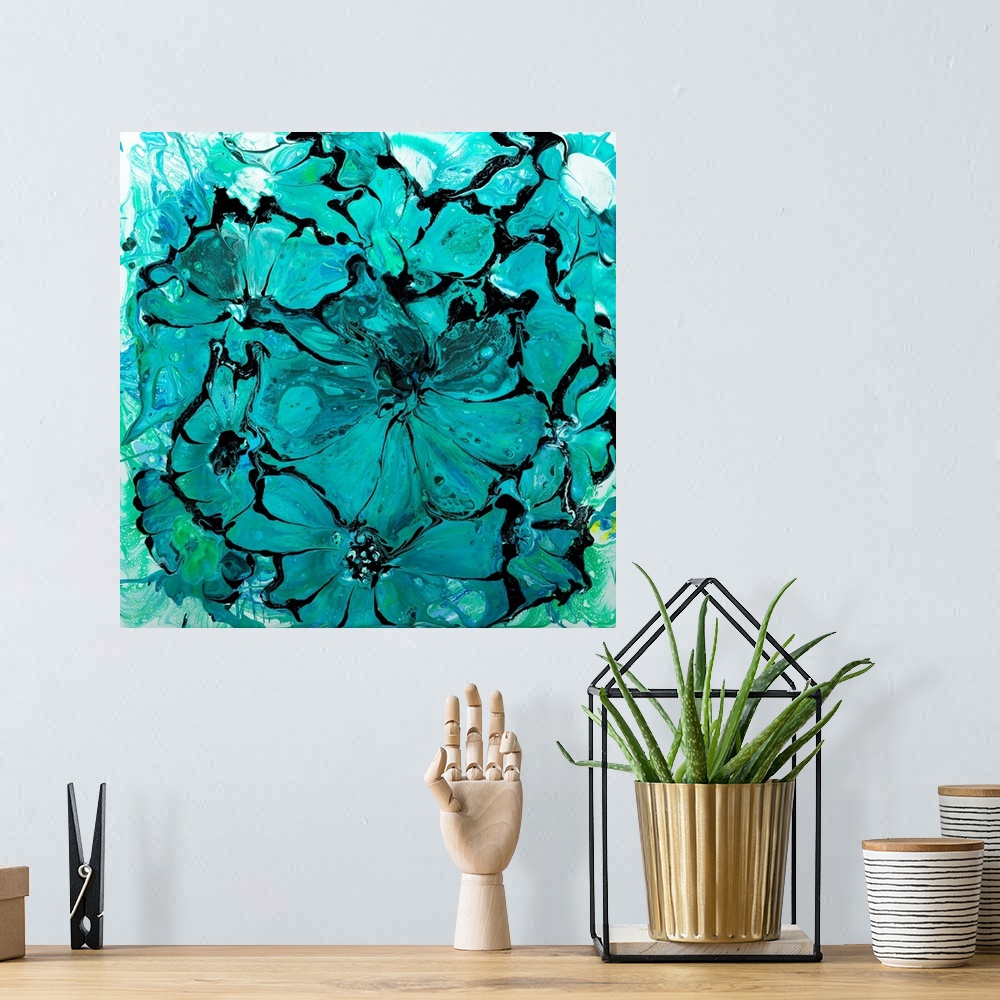 A bohemian room featuring Pour painting of flowers in bright turquoise colors with flowing patterns.