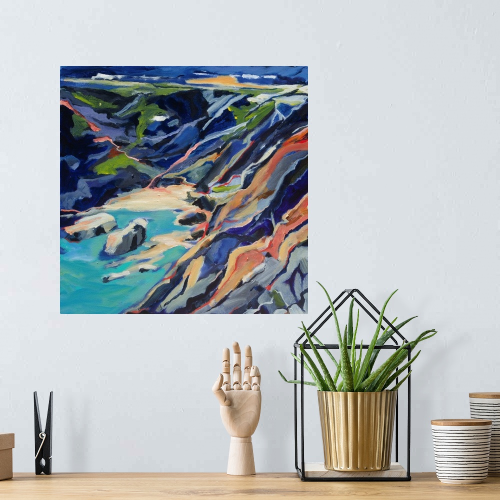 A bohemian room featuring A ontemporary scene of a rocky beach cove from above with turquoise and deep blues.