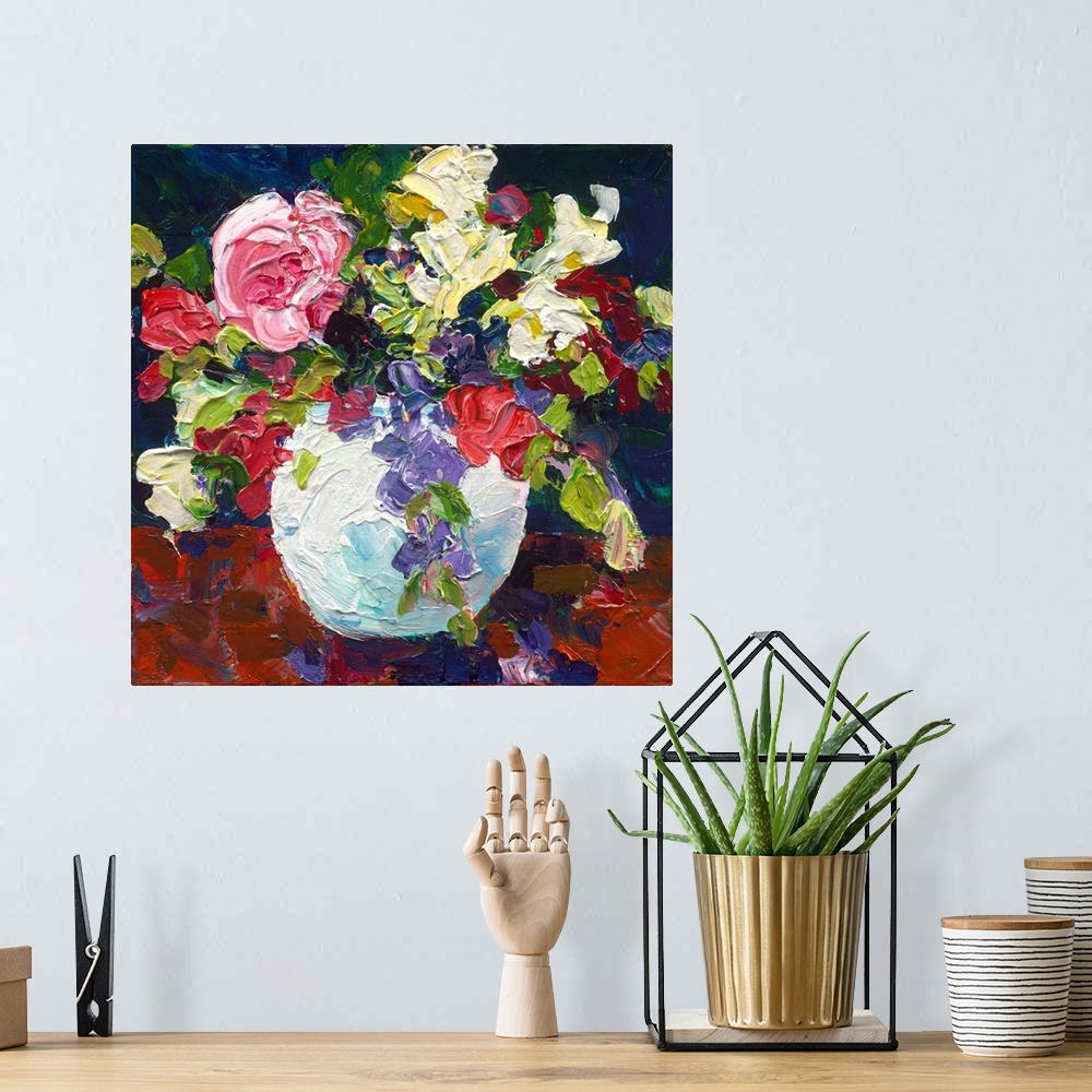 A bohemian room featuring Roses and foliage in a white vase painted with thick textured paint.