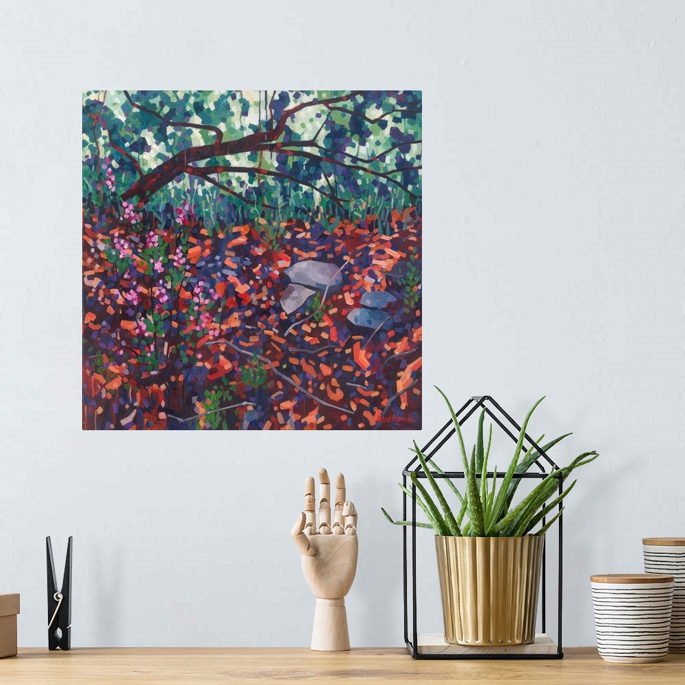 A bohemian room featuring Atmospheric painting of fallen tree with pink flowers and red and orange foreground.
