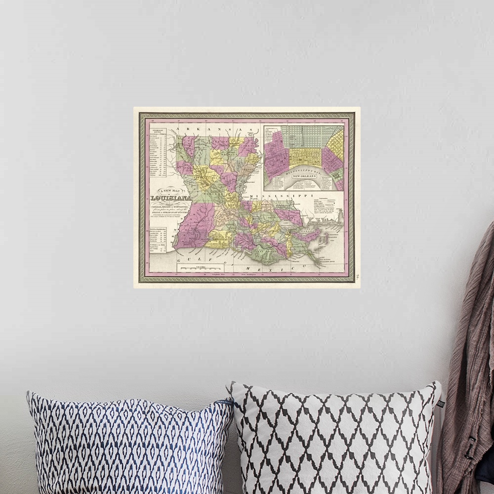 A bohemian room featuring This large piece is an antique map of the state of Louisiana. Different colors are used to separa...