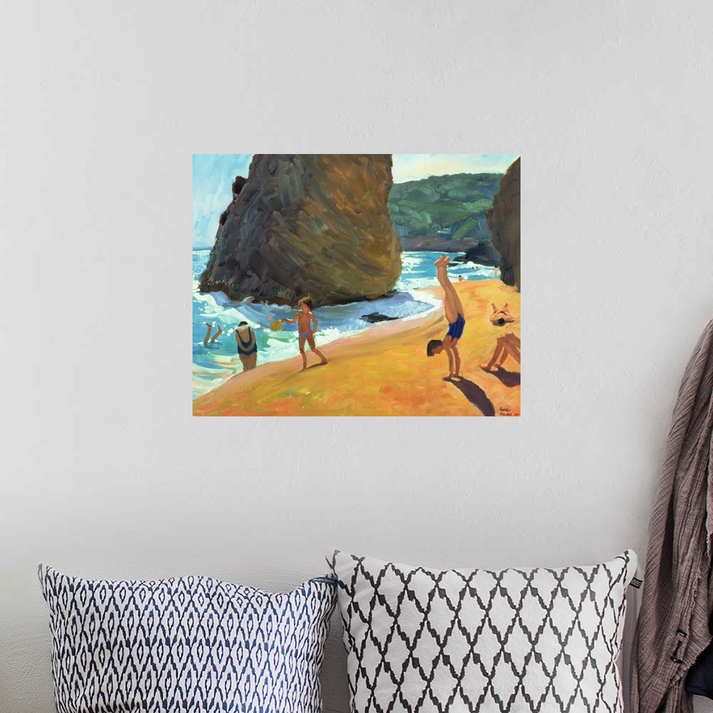 A bohemian room featuring Horizontal painting on a big canvas of people playing on the beach, near the water, large boulder...