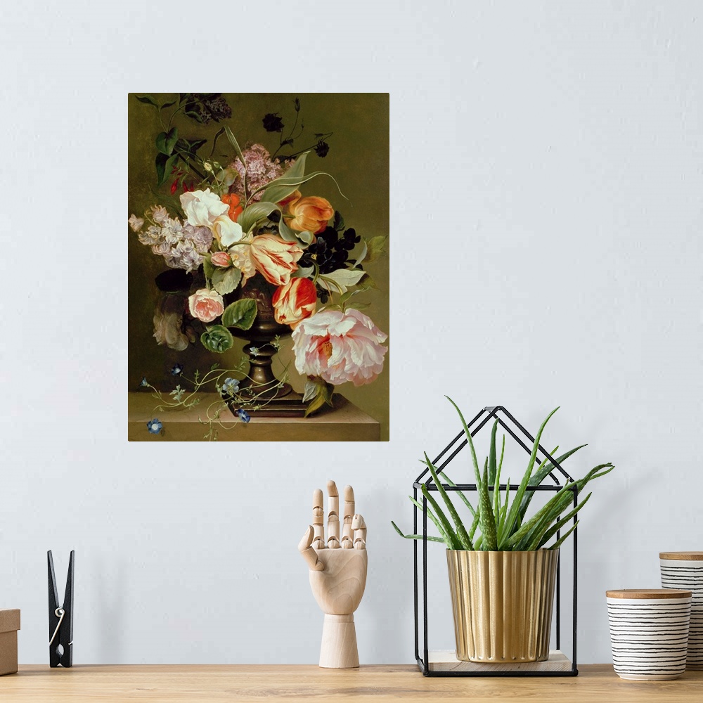 A bohemian room featuring Portrait artwork on a large canvas of a floral still life.  Numerous types of lowers and leaves h...