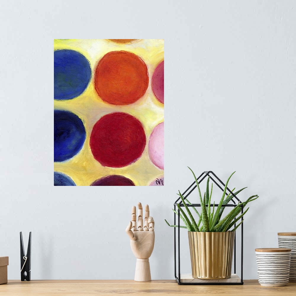 A bohemian room featuring Contemporary painting of a colorful circles against a yellow background.
