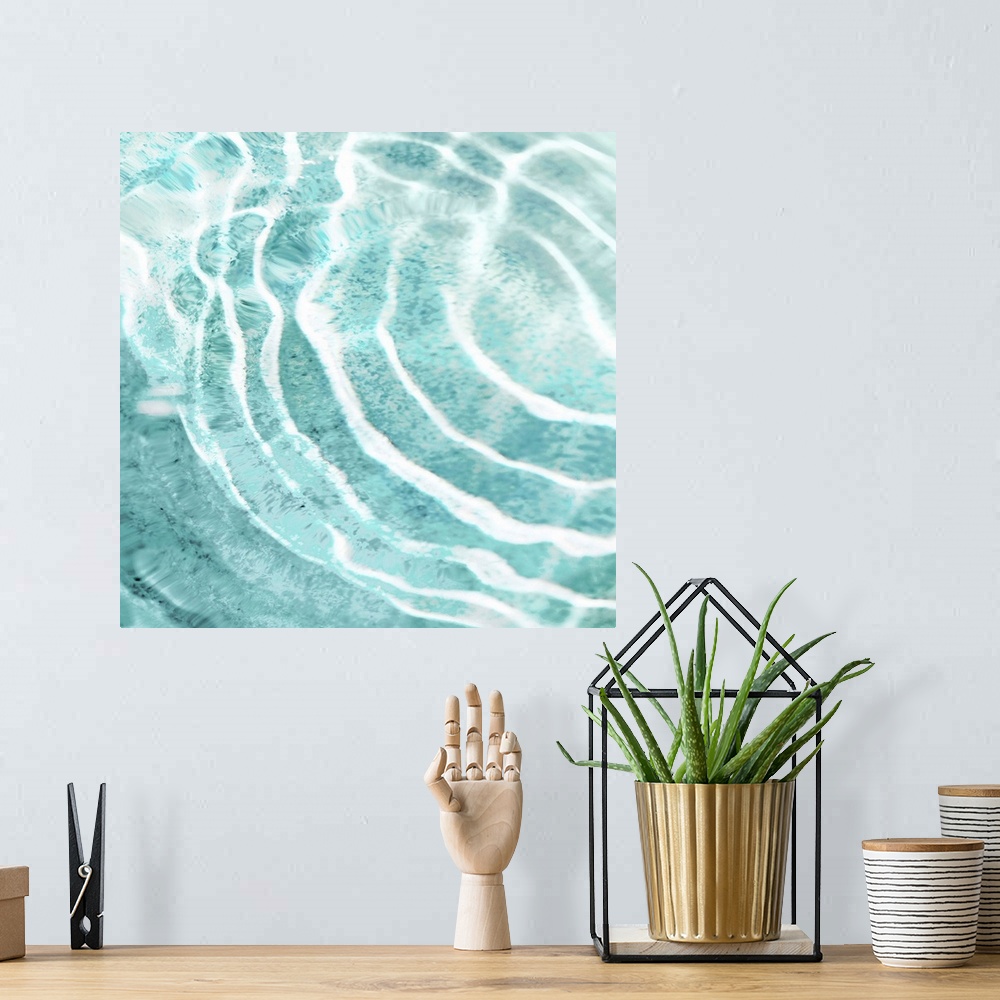 A bohemian room featuring Square photograph of ripples in clear water.