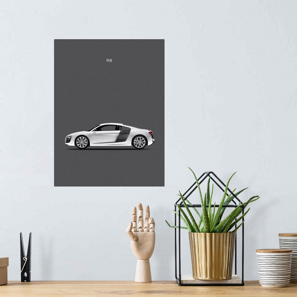 A bohemian room featuring Photograph of a silver Audi R8 printed on a dark gray background