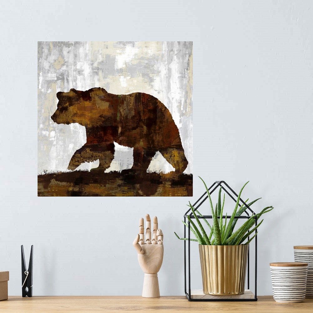 A bohemian room featuring Square decor with a silhouette of a brown bear on a gray, tan, and white background.