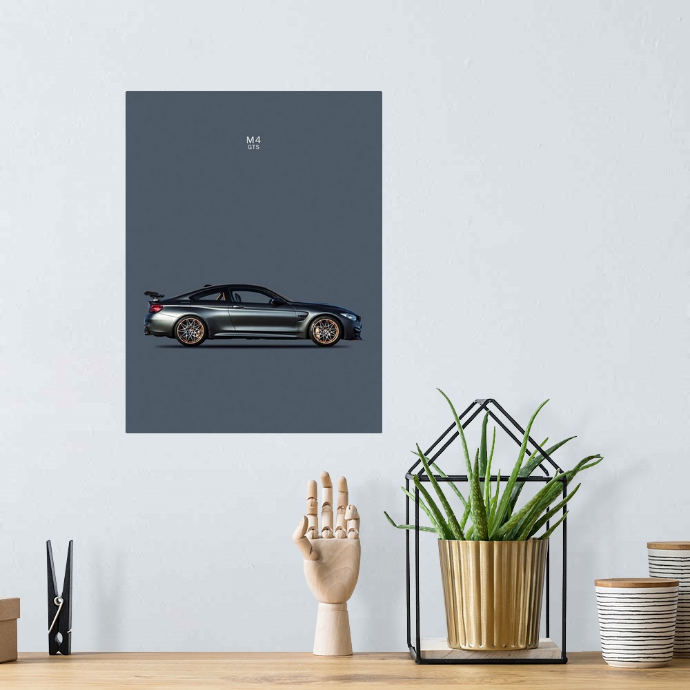 A bohemian room featuring Photograph of a dark gray BMW M4 GTS printed on a dark gray background