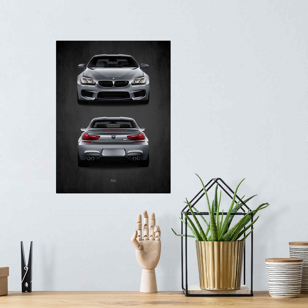 A bohemian room featuring Photograph of the front and back of a silver BMW M6 printed on a black background with a dark vig...