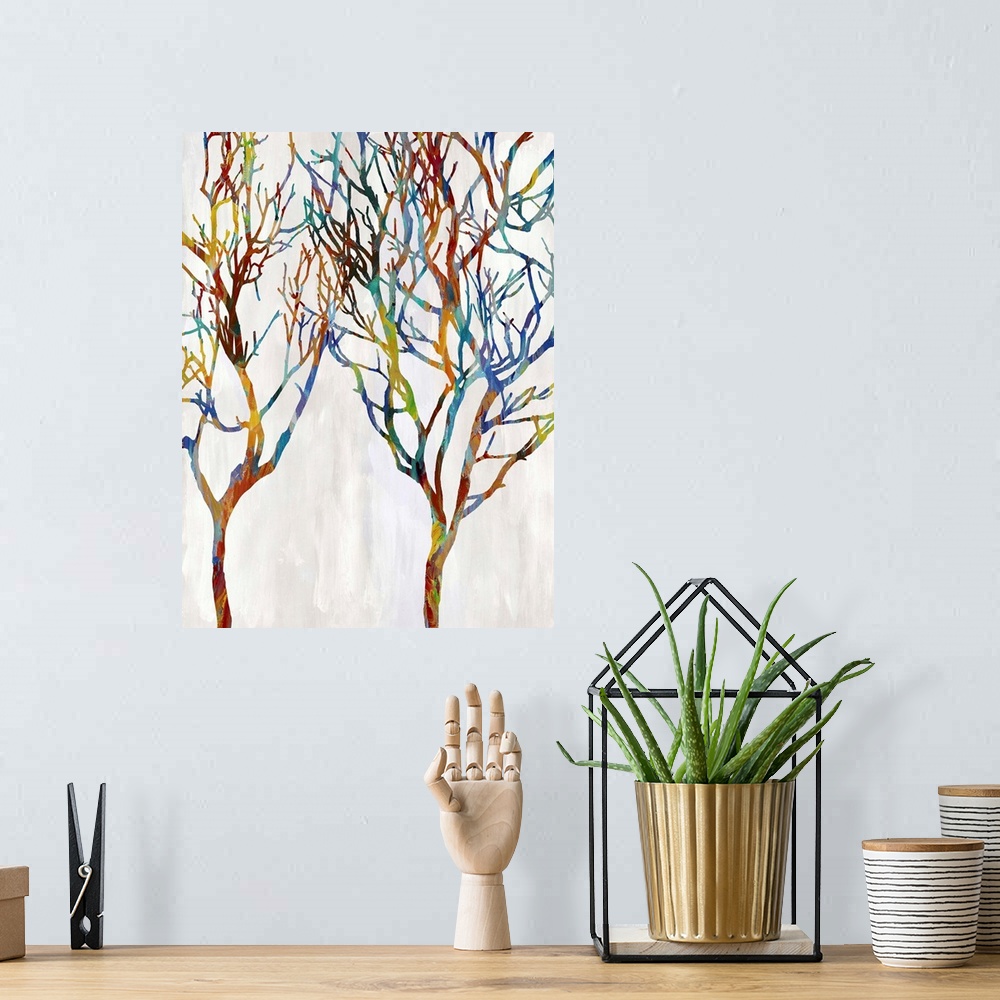 A bohemian room featuring Colorful silhouettes of two leafless trees on a white and gray background.