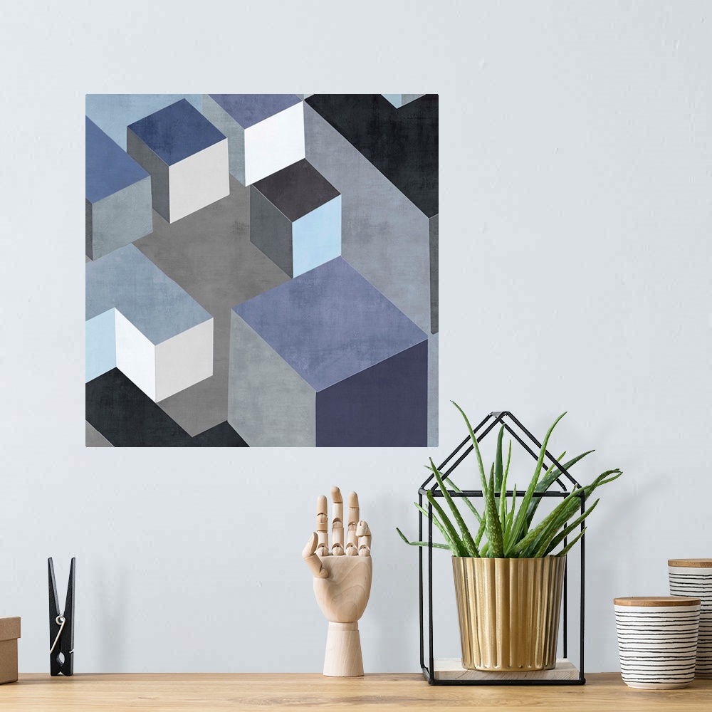 A bohemian room featuring Abstract square art created with black, white, silver, and blue squares creating 3D looking cubes...