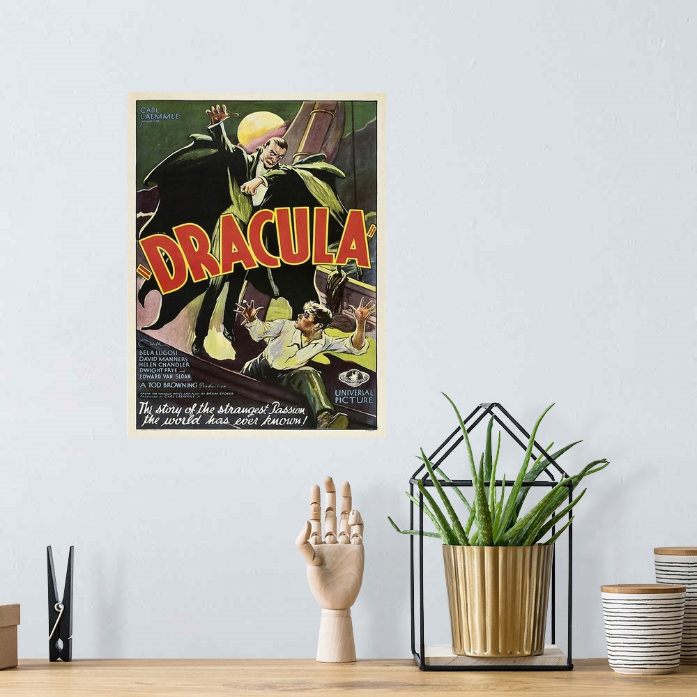 A bohemian room featuring Vintage movie poster for "Dracula" from 1931.
