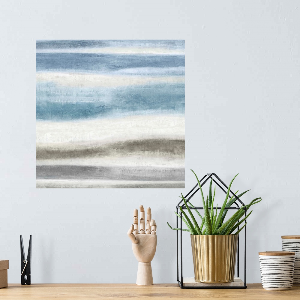 A bohemian room featuring Square abstract painting created with blue and gray wavy brushstrokes running horizontally across...