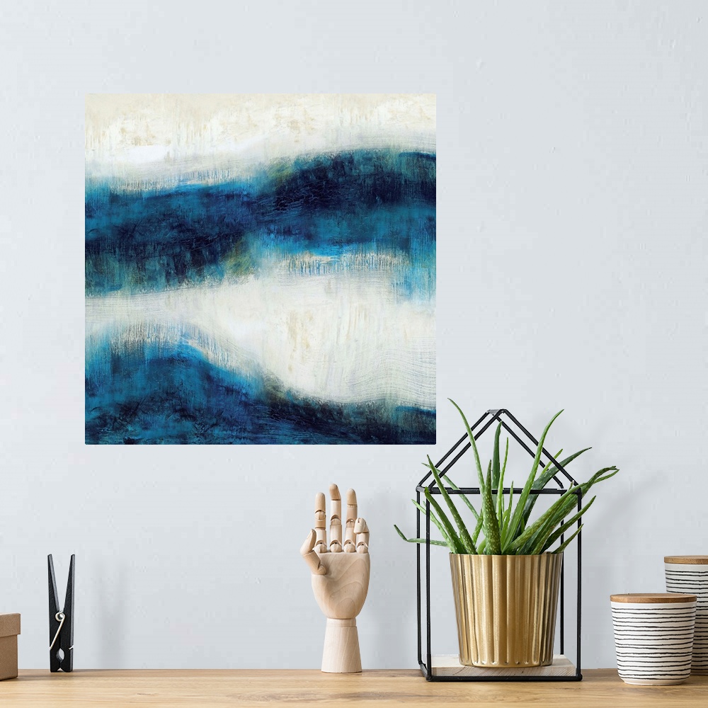 A bohemian room featuring Square abstract art made with shades of blue and neutral hues.