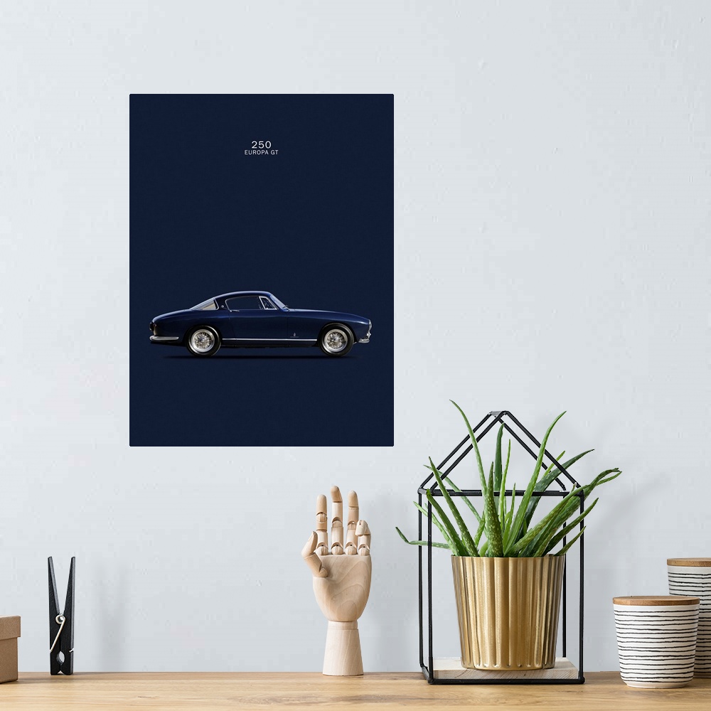 A bohemian room featuring Photograph of a navy blue Ferrari 250 Europa GT 1955 printed on a dark blue background