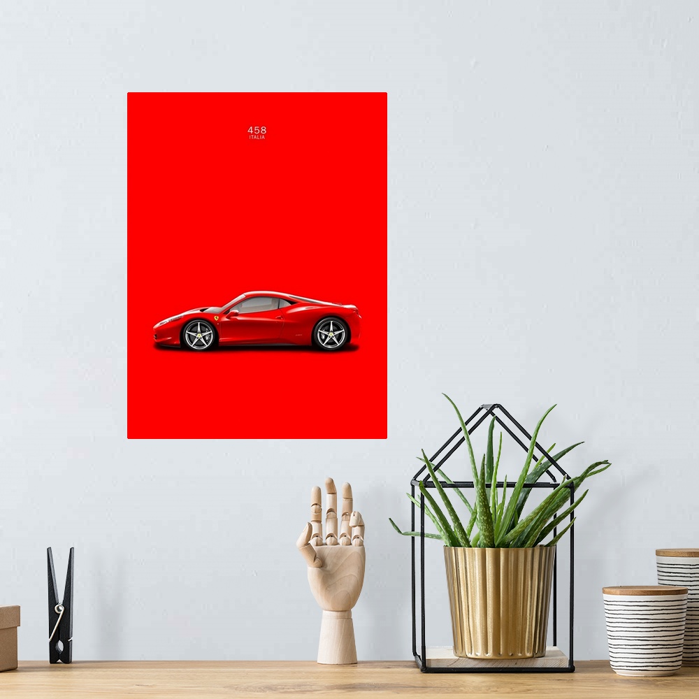 A bohemian room featuring Photograph of a bright red Ferrari 458 Italia printed on a red background