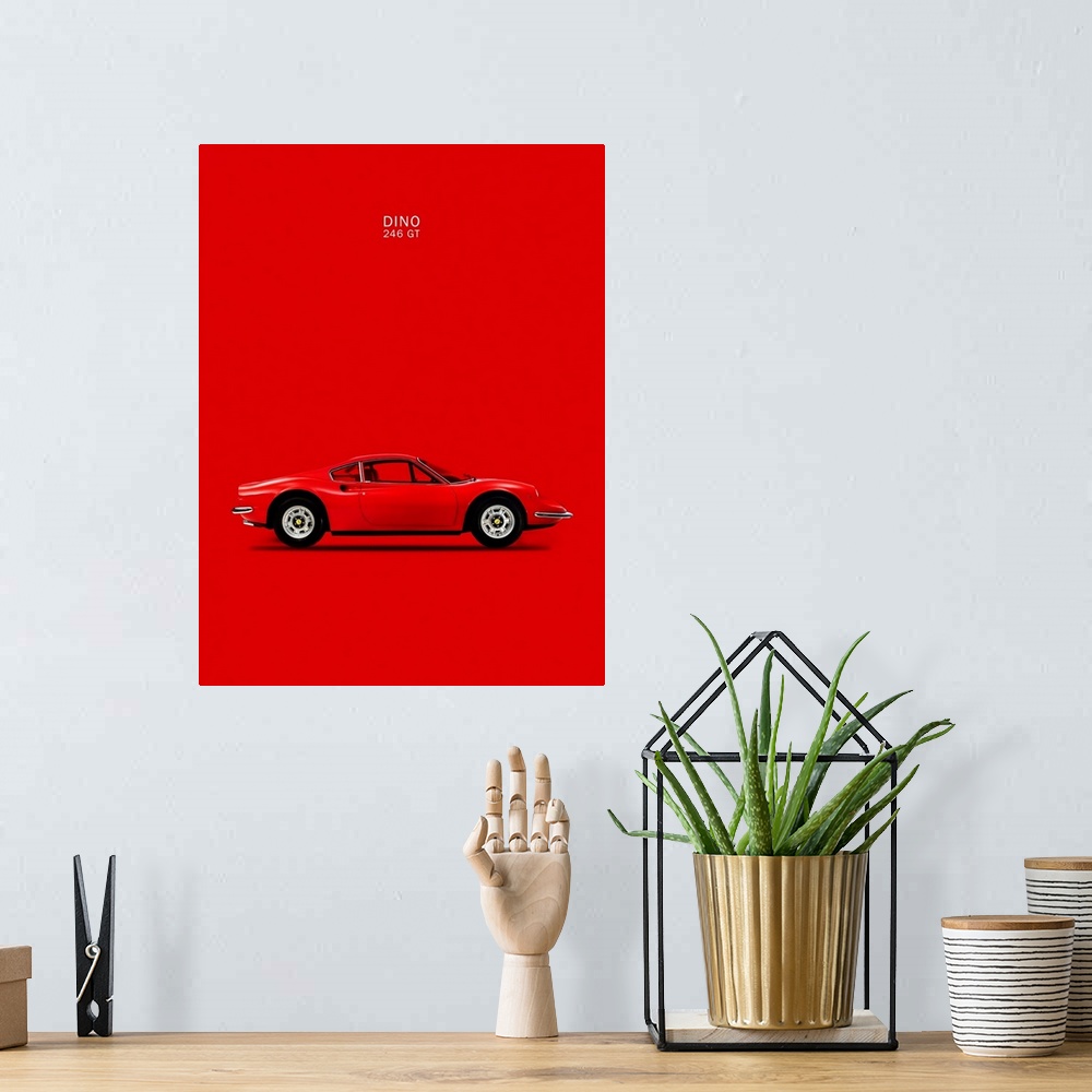 A bohemian room featuring Photograph of a bright red Ferrari Dino 246GT 69 printed on a red background