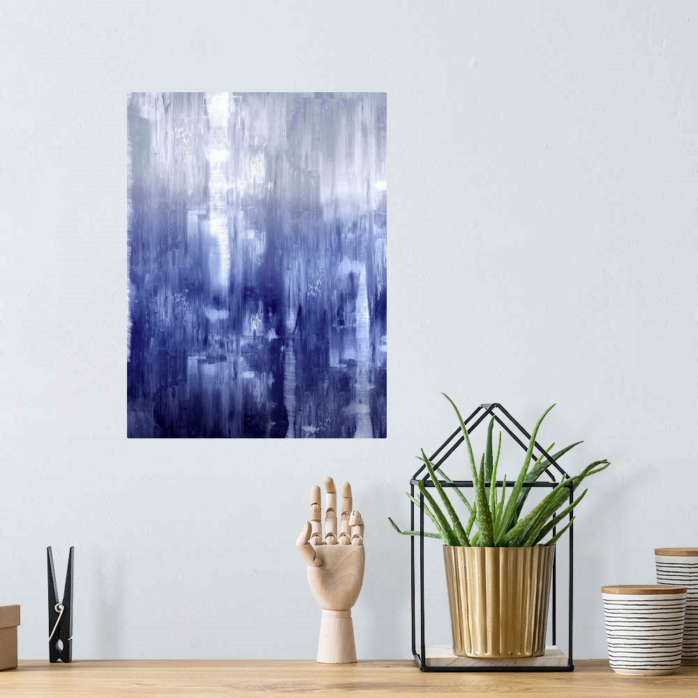 A bohemian room featuring Vertical abstract painting of fading shades of indigo streaking down the canvas.