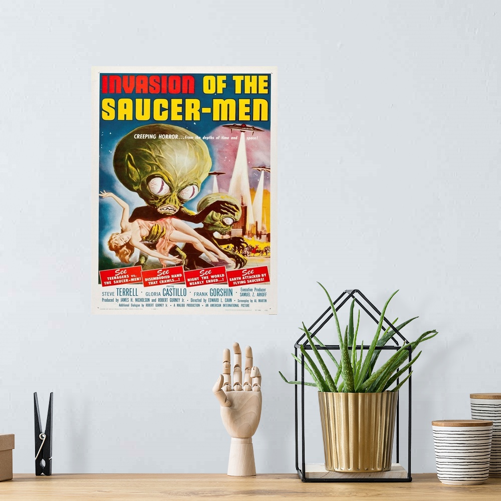 A bohemian room featuring Vintage movie poster for "Invasion Of The Saucer Men".