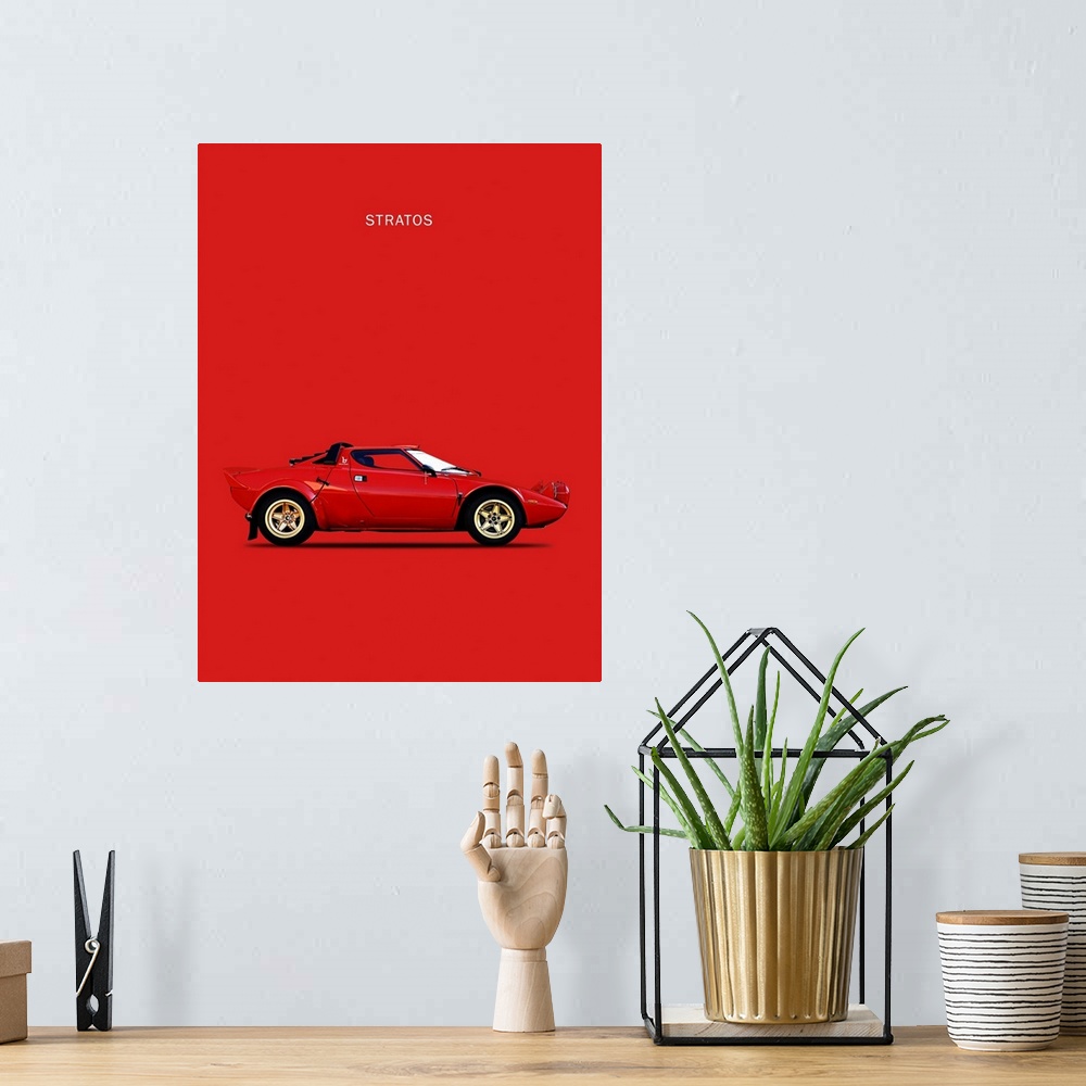 A bohemian room featuring Photograph of a red Lancia Stratos 1974 printed on a red background