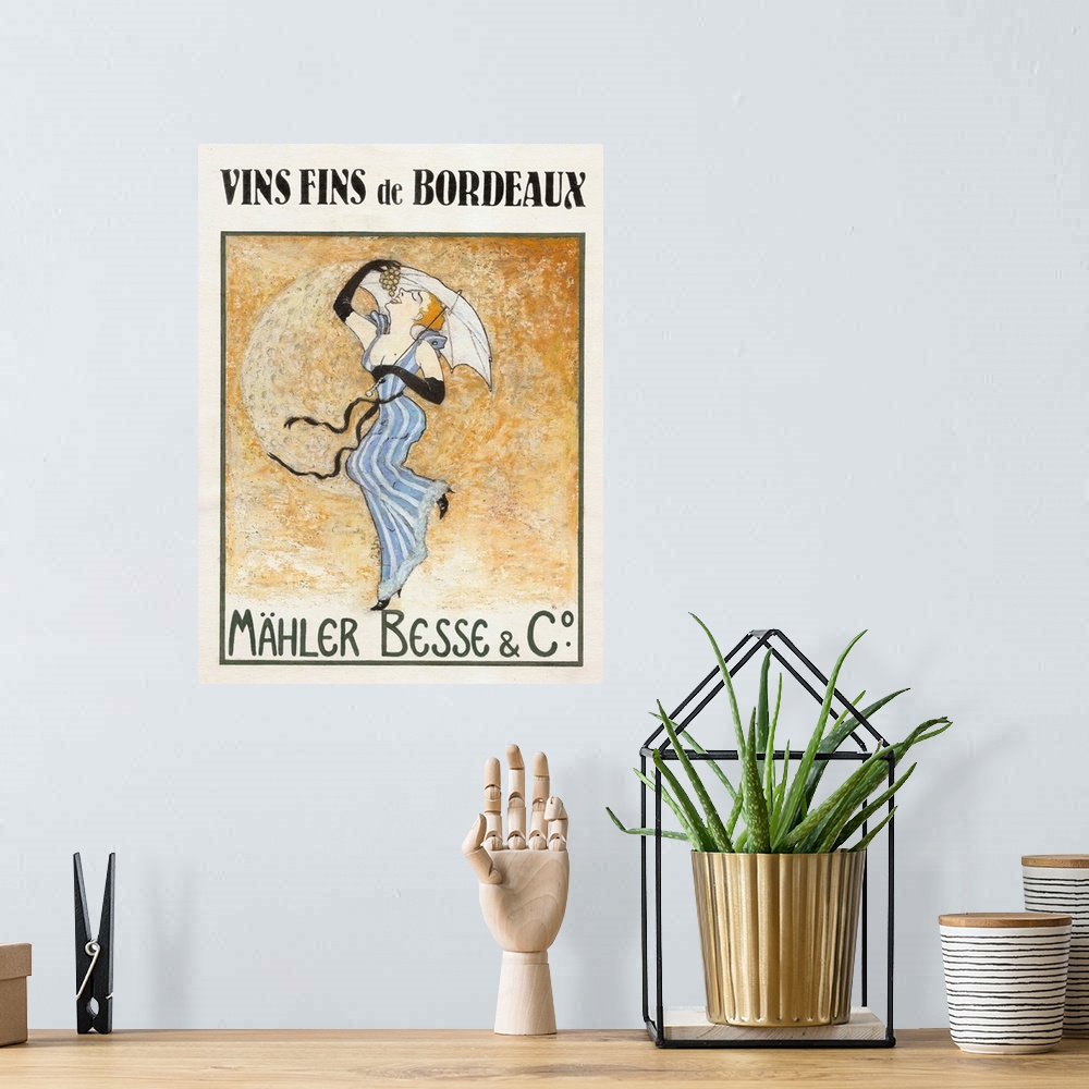 A bohemian room featuring French poster advertising wine with a woman carrying an umbrella and eating grapes with the moon ...