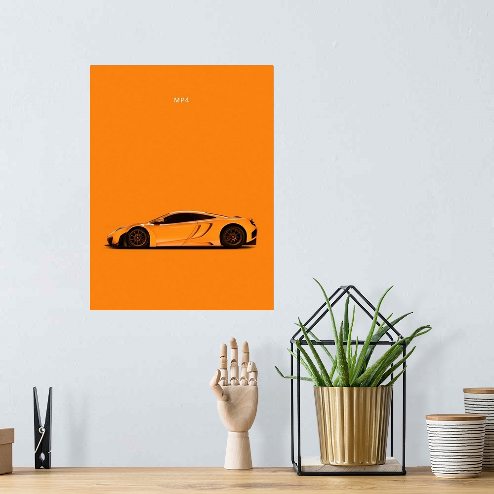A bohemian room featuring Photograph of an orange McLaren MP4 printed on an orange background