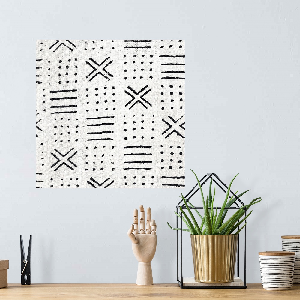 A bohemian room featuring Square abstract black and white patterned art created with lines and dots.