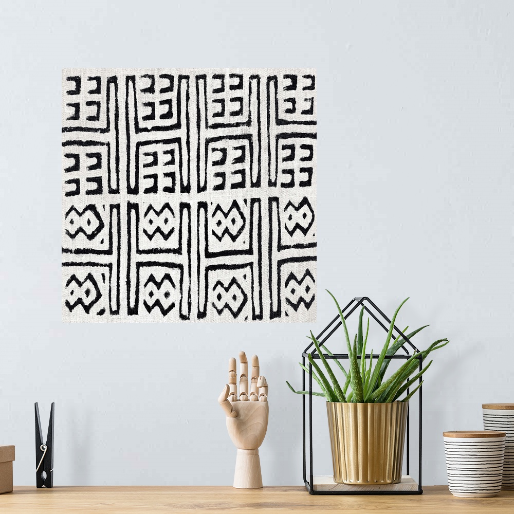 A bohemian room featuring Square abstract black and white patterned art created with lines and dots.