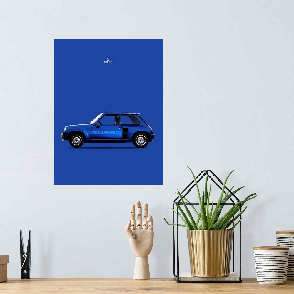 A bohemian room featuring Photograph of a blue Renault 5 Turbo 1983 printed on a blue background