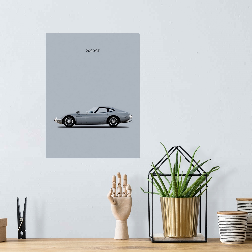 A bohemian room featuring Photograph of a silver Toyota 2000GT printed on a gray background
