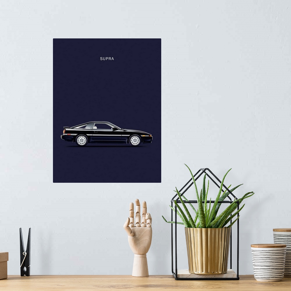 A bohemian room featuring Photograph of a black Toyota Supra Turbo printed on a navy blue background