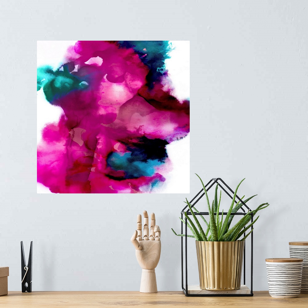 A bohemian room featuring Square abstract art made with shades of blue and bright pink on a white background.