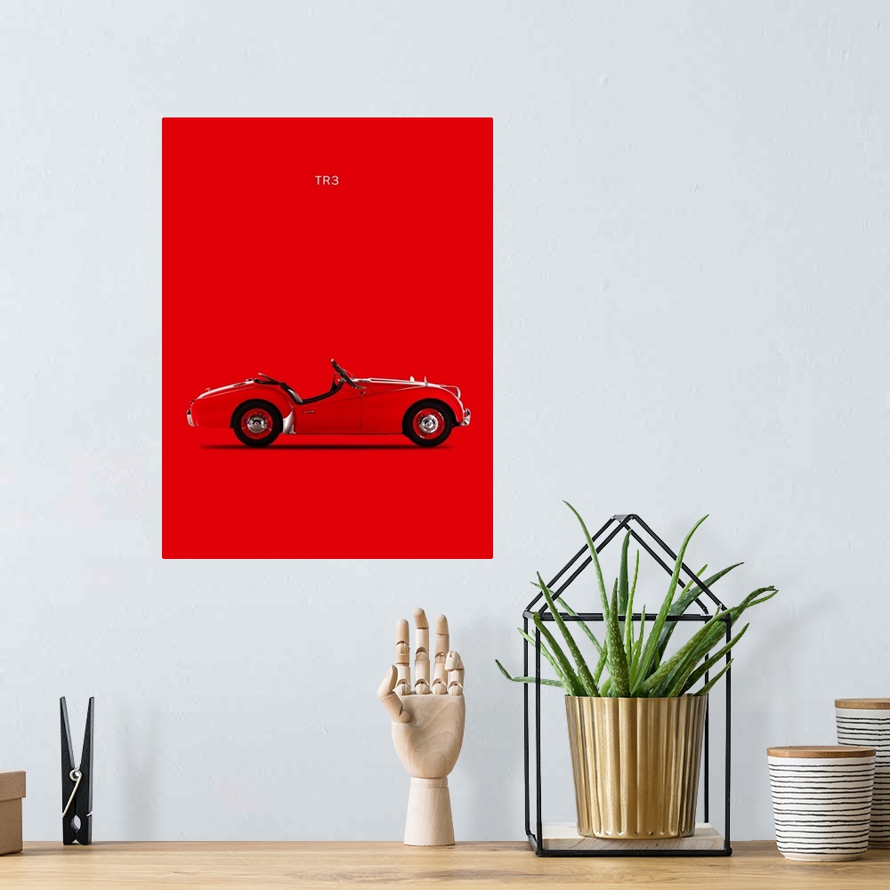 A bohemian room featuring Photograph of a red Triumph TR3 1959 printed on a red background