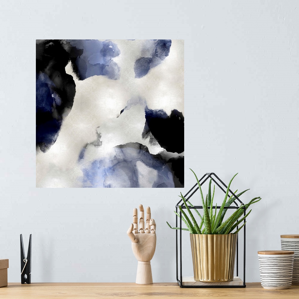 A bohemian room featuring Abstract painting with indigo and black hues splattered together on a silver background.