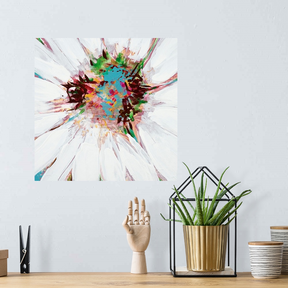 A bohemian room featuring A square painting of close up center of a daisy in multiple colors.