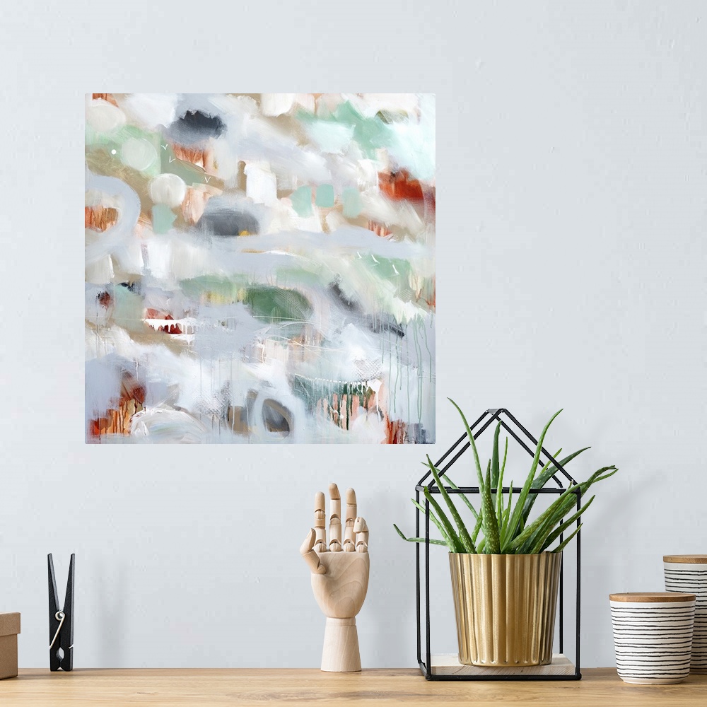 A bohemian room featuring Square abstract painting of spots of color peeping through light gray with small drips of paint a...