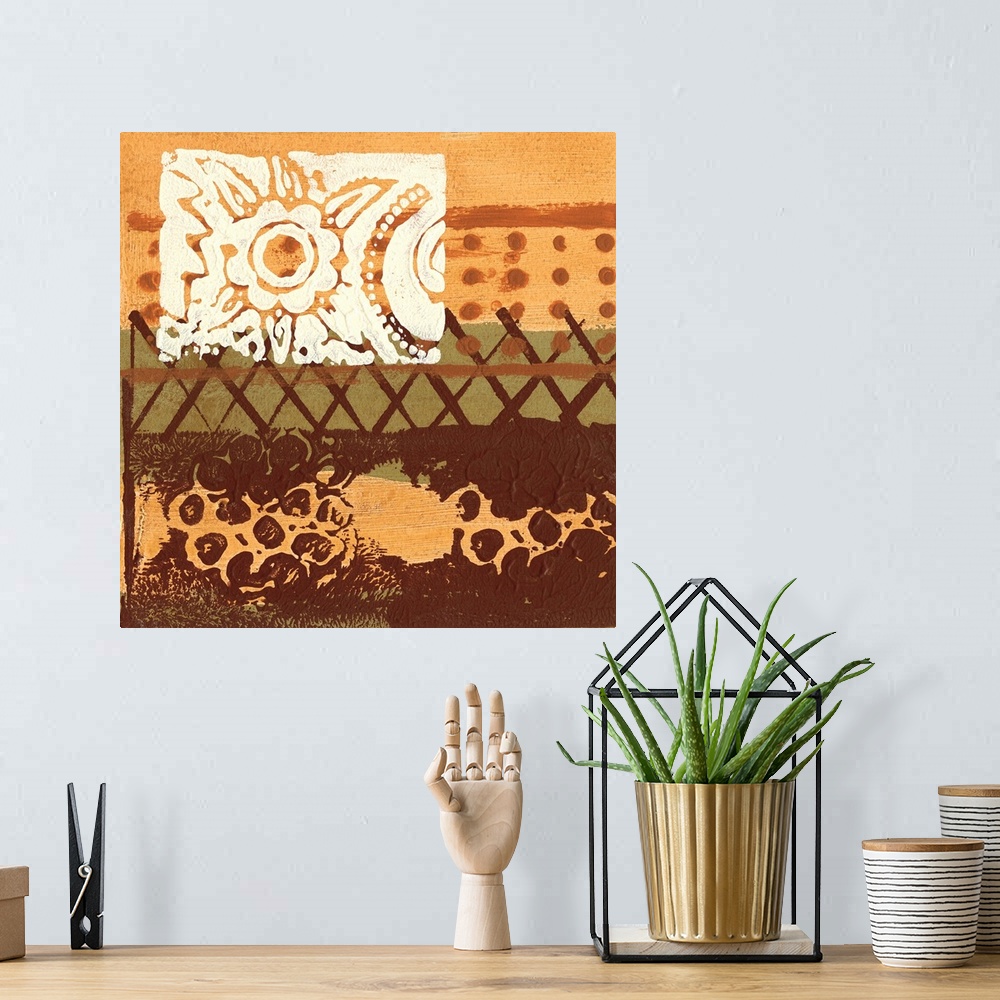 A bohemian room featuring Square abstract painting in earth tone colors of textured paint with one row of x's and another o...