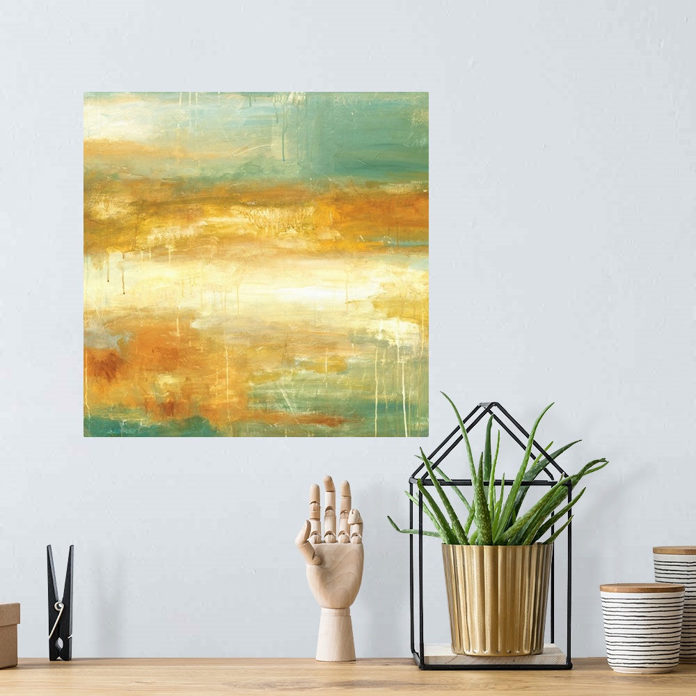 A bohemian room featuring Square abstract painting in textured colors of green, gold and cream.