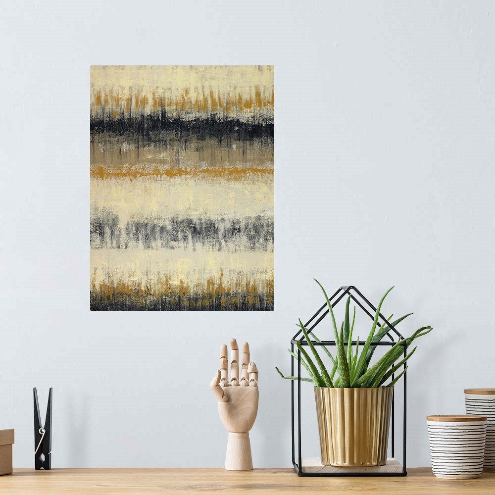 A bohemian room featuring Vertical abstract of horizontal rows of textured lines in black, beige and mustard colors.