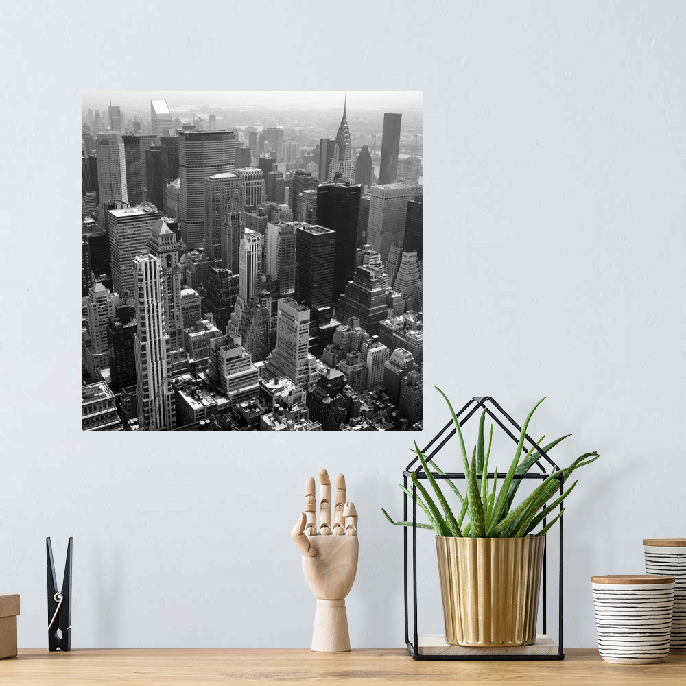 A bohemian room featuring Black and white photo of New York.