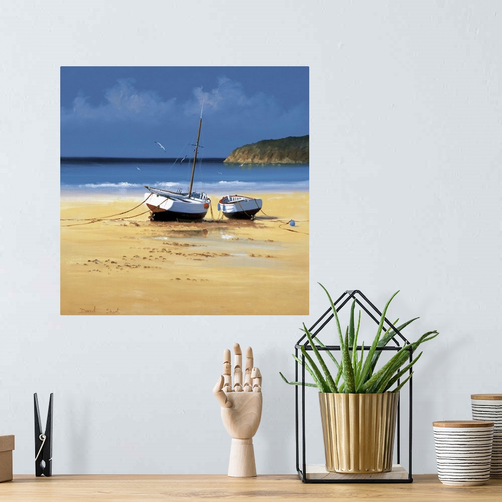 A bohemian room featuring Contemporary painting of two boats moored on a sandy beach.