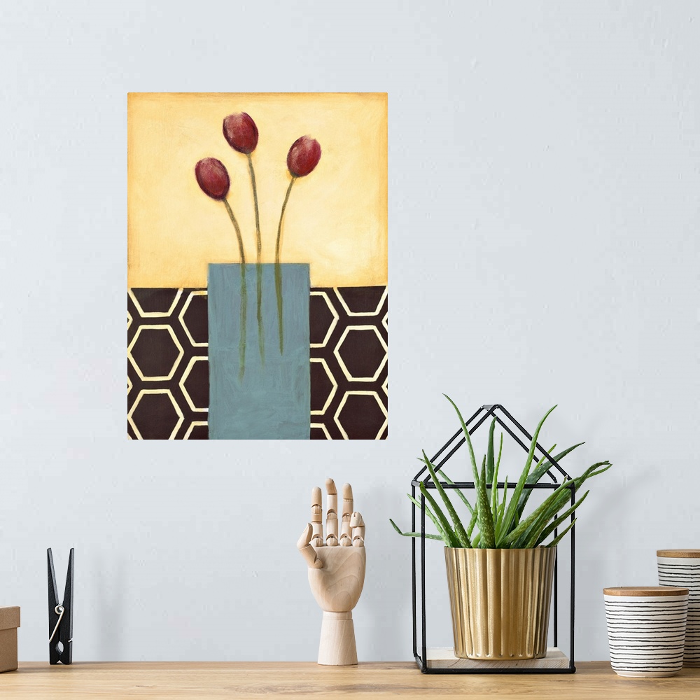 A bohemian room featuring Vertical painting of a vase of red tulips with modern patterned backdrop.