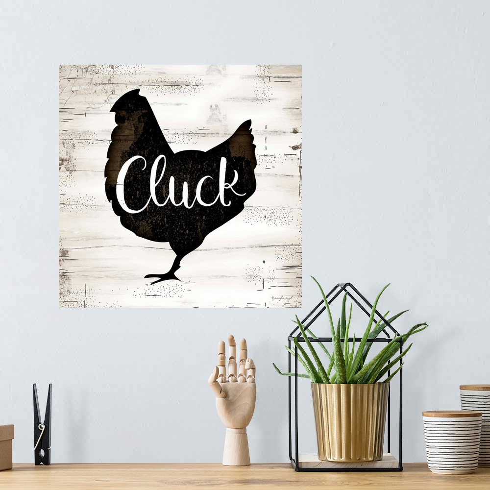 A bohemian room featuring Rustic art of the silhouette of a chicken with script text over it, on a background with an old w...