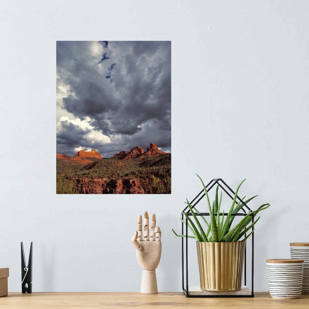 A bohemian room featuring USA, Arizona, Oak Creek Canyon. Menacing clouds race through the red rocks of Oak Creek Canyon in...
