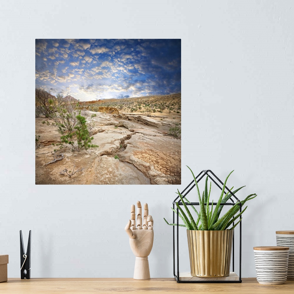 A bohemian room featuring Aktau Mountains scenery with drought earth at dramatic blue sky in National Park Altyn Emel in Ka...