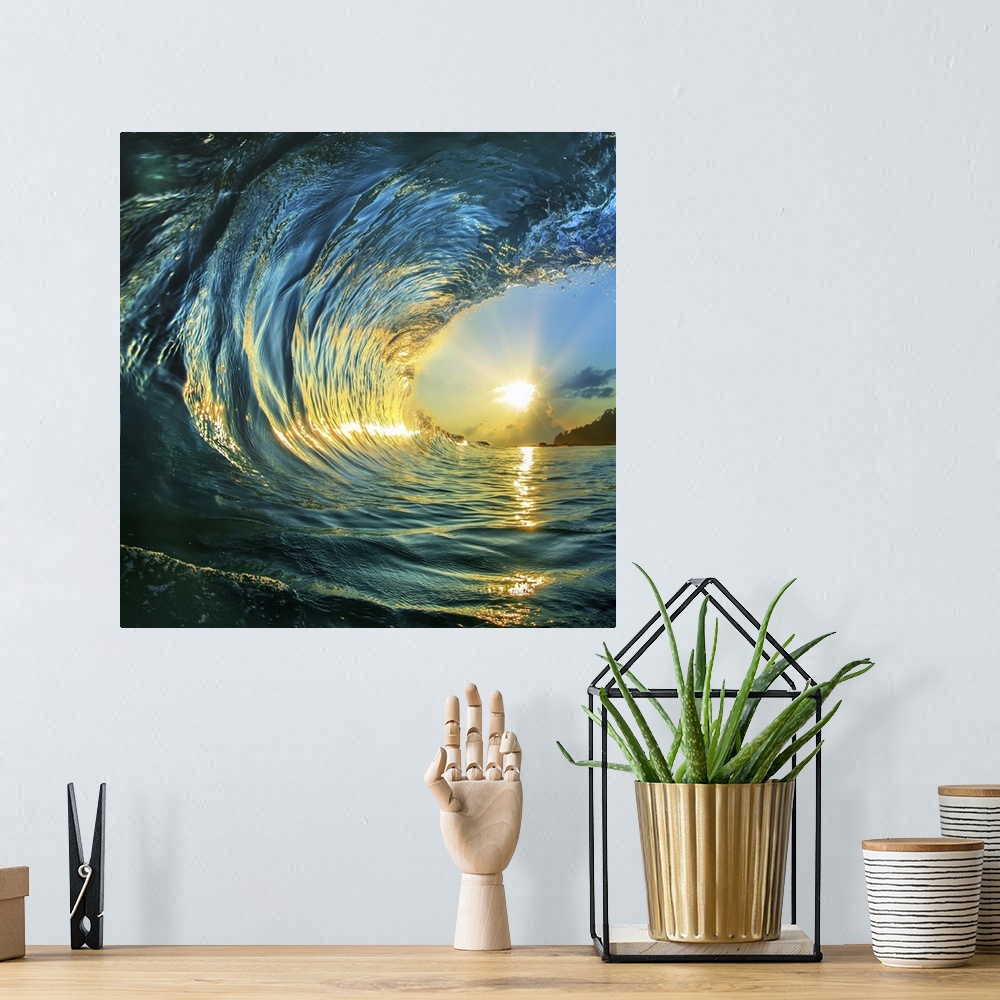 A bohemian room featuring Rough colored ocean wave falling down at sunset time.